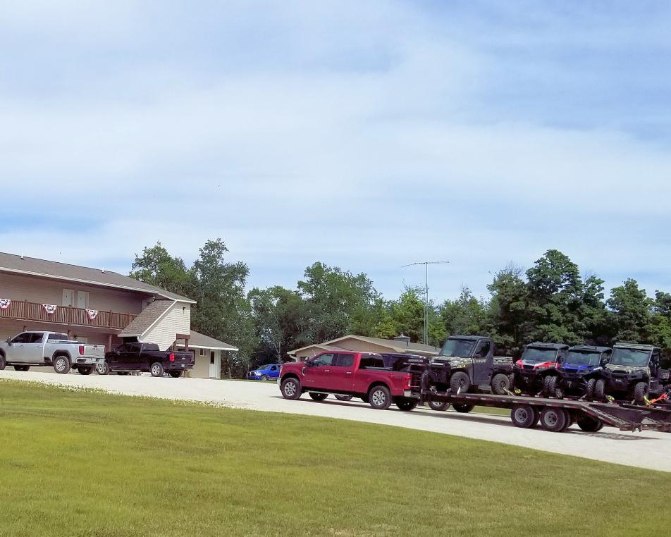 Trailer of ATVs parked in front of the Voyageurs Motel